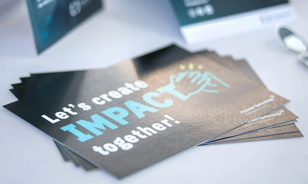 Sign reading: "Let's create impact together"