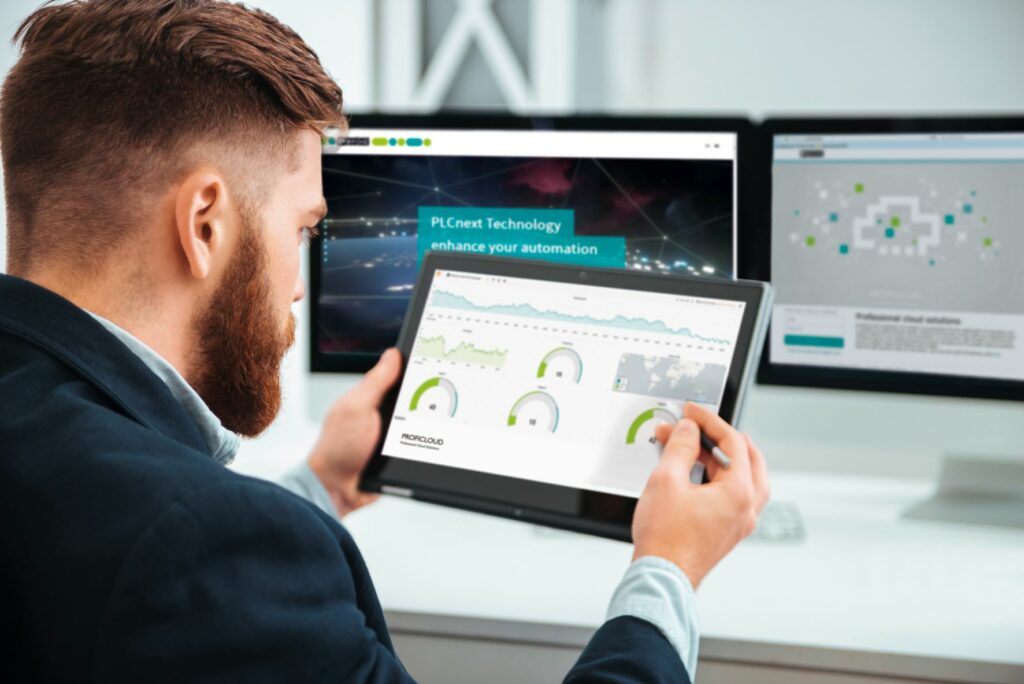 Man in front of iPad with Proficloud dashboard on screen